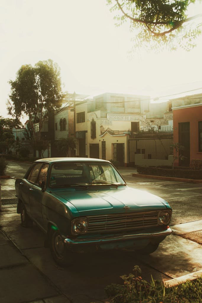 A retro car parked on a sunlit street in Lima, capturing a nostalgic urban scene.