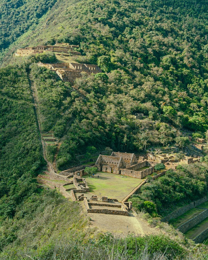 Discover the ancient Incan ruins of Choquequirao nestled in the Peruvian mountains.